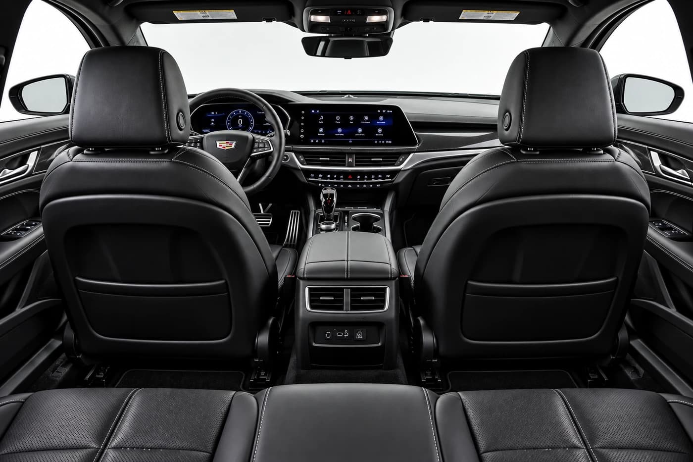 Cadillac CT5 front cabin with black leather seats, steering wheel and dashboard.