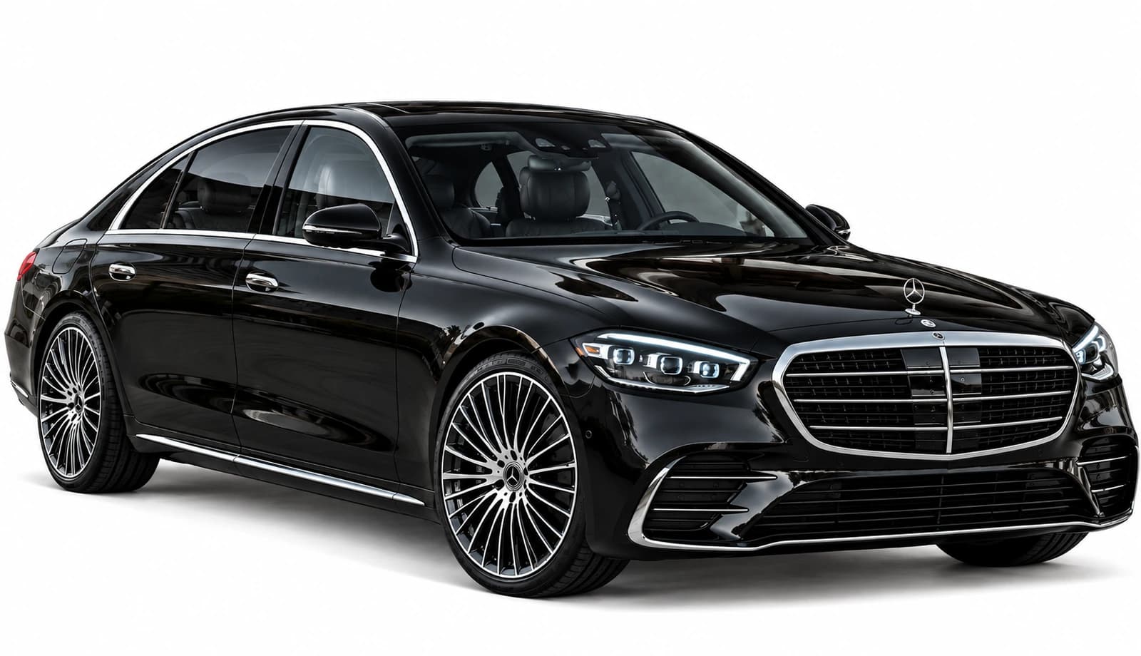 A black Mercedes-Benz S-Class sedan photographed from a front three-quarter angle with chrome grille and alloy wheels.