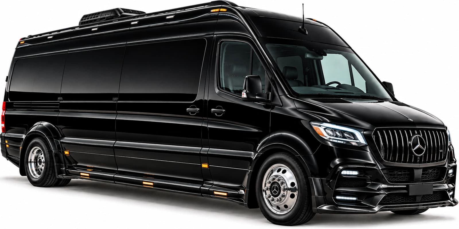 The Mercedes-Benz Executive Sprinter van is photographed from a front three-quarter angle with chrome wheels and tinted windows.